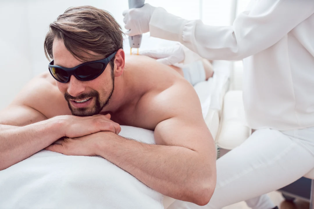 Man Under Treatment In A Hair Removal Studio-scaled