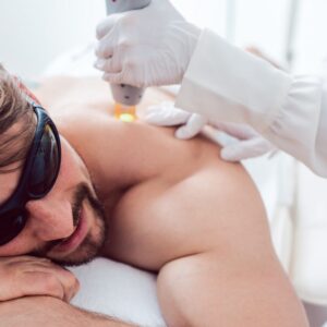 Man Under Treatment In A Hair Removal Studio